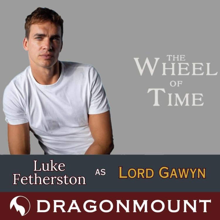 Luke Fetherston as Lord Gawyn. Included is a headshot of Luke Fetherston leaning forward squinting his eyes in a model like pose. His hair is an auburn reddish brown, and is wearing a plain white tee shirt.