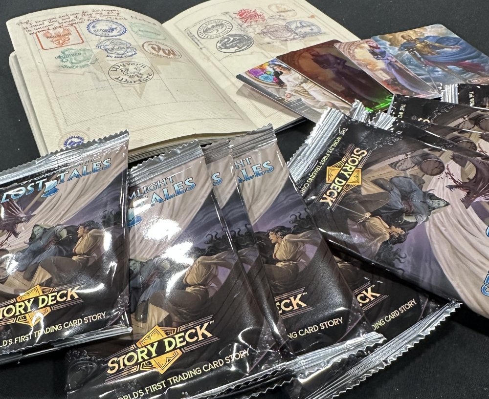 glossy packets of Story Deck cards that read "Lost Tales" and an open passport with colorful stamps on it